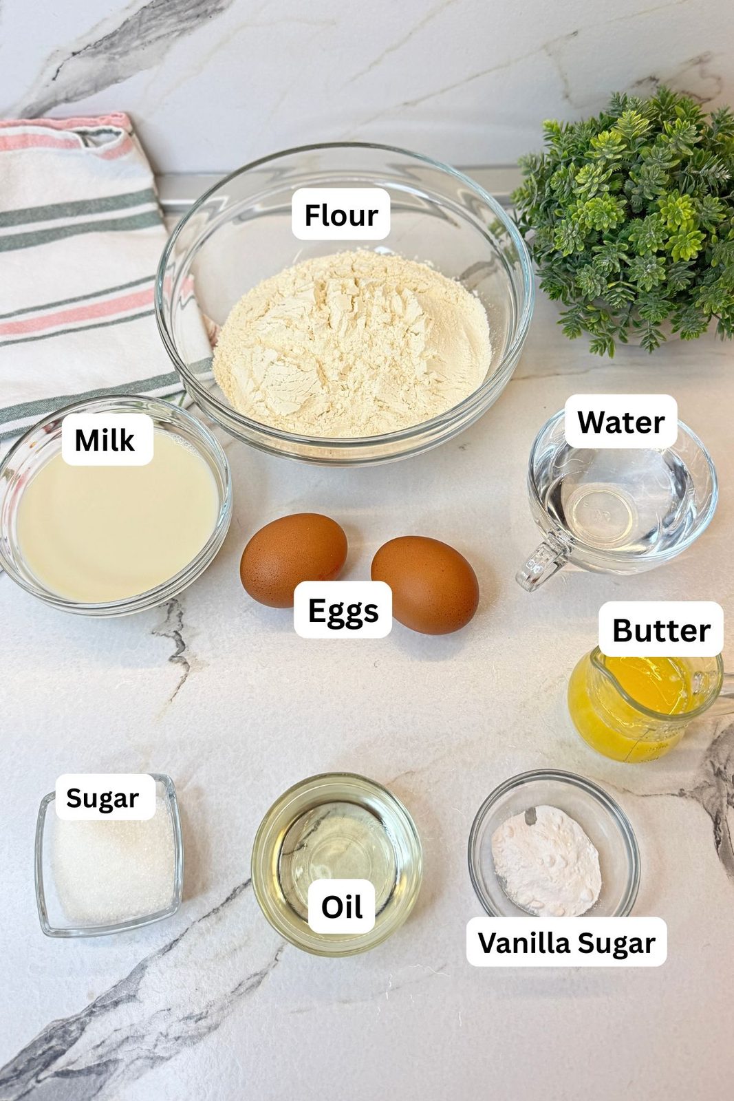 Ingredients for an easy crepes recipe including flour, milk, water, eggs, butter, oil, sugar, and vanilla sugar