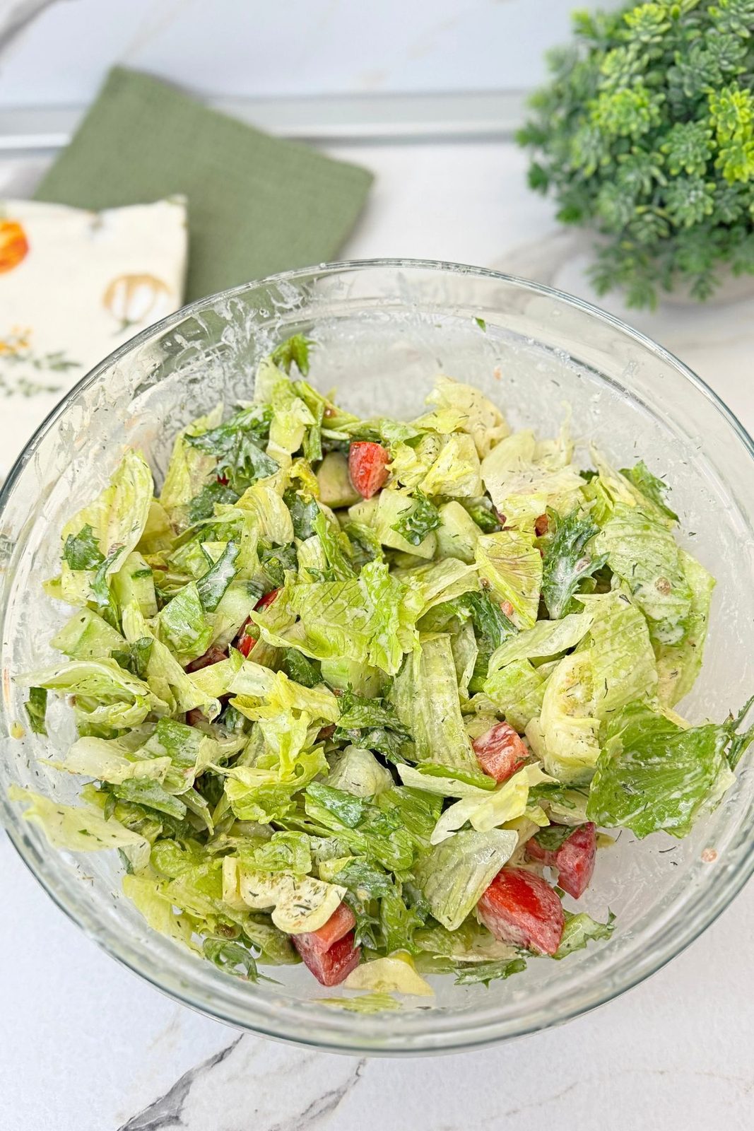 Creamy lemon dressing added to chopped lettuce, arugula, cucumber, tomatoes, and bell pepper.