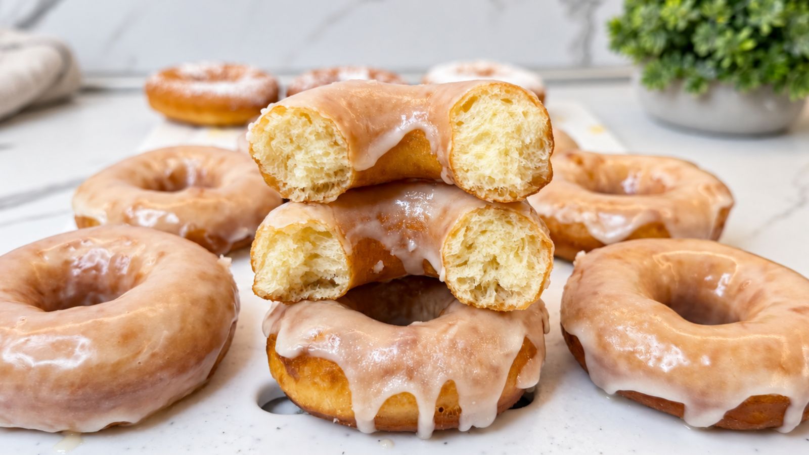 Soft and fluffy bakery-style glazed donuts with vanilla glaze