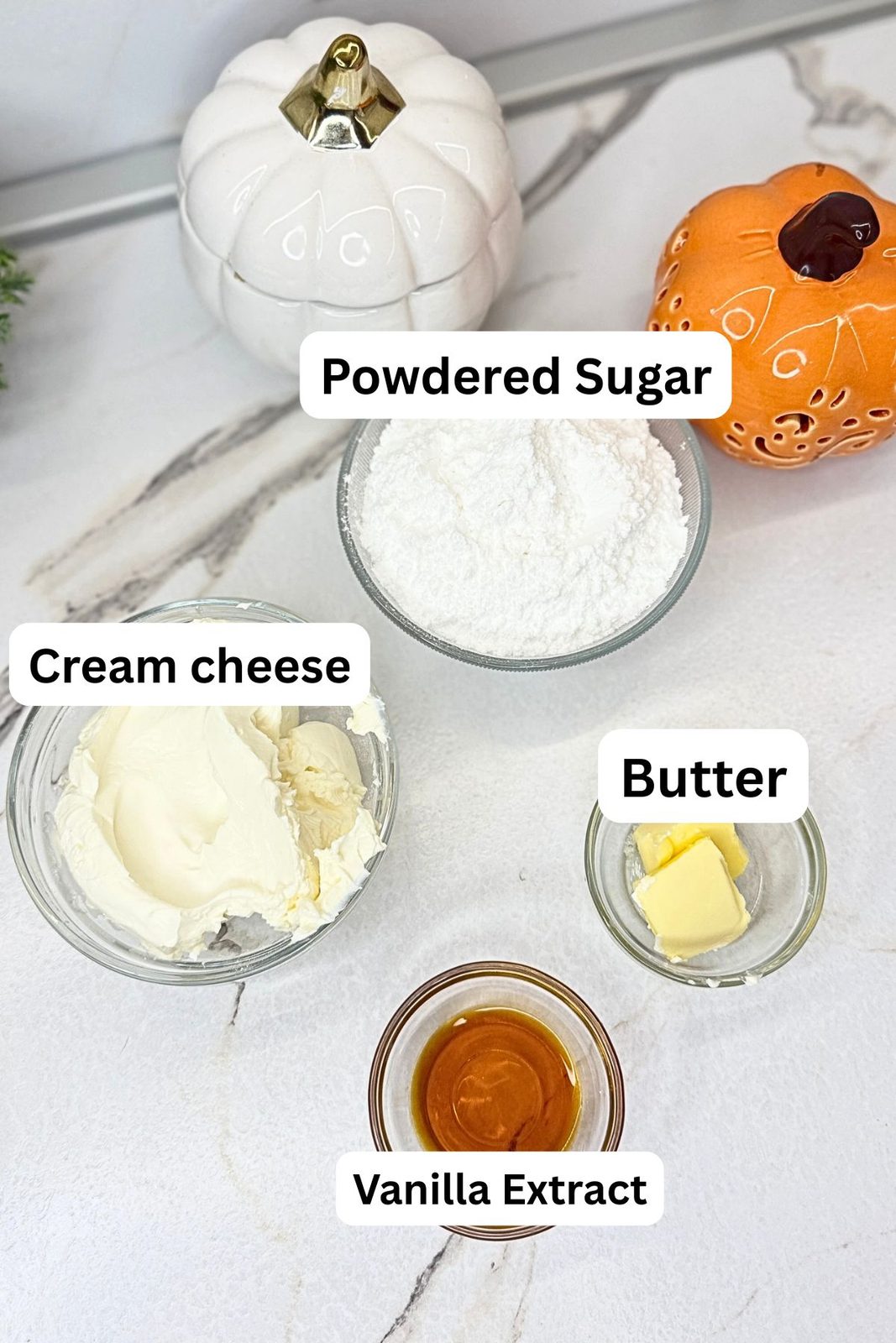 Cream cheese, butter, powdered sugar, and vanilla extract for pumpkin cake roll filling.