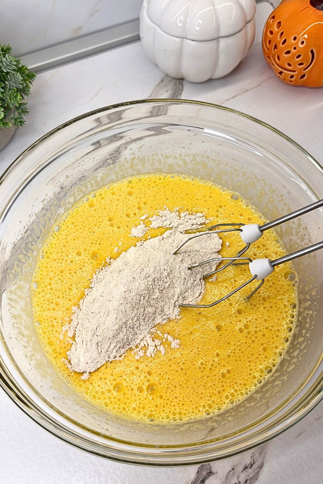 Dry ingredients folded into the pumpkin cake roll batter.
