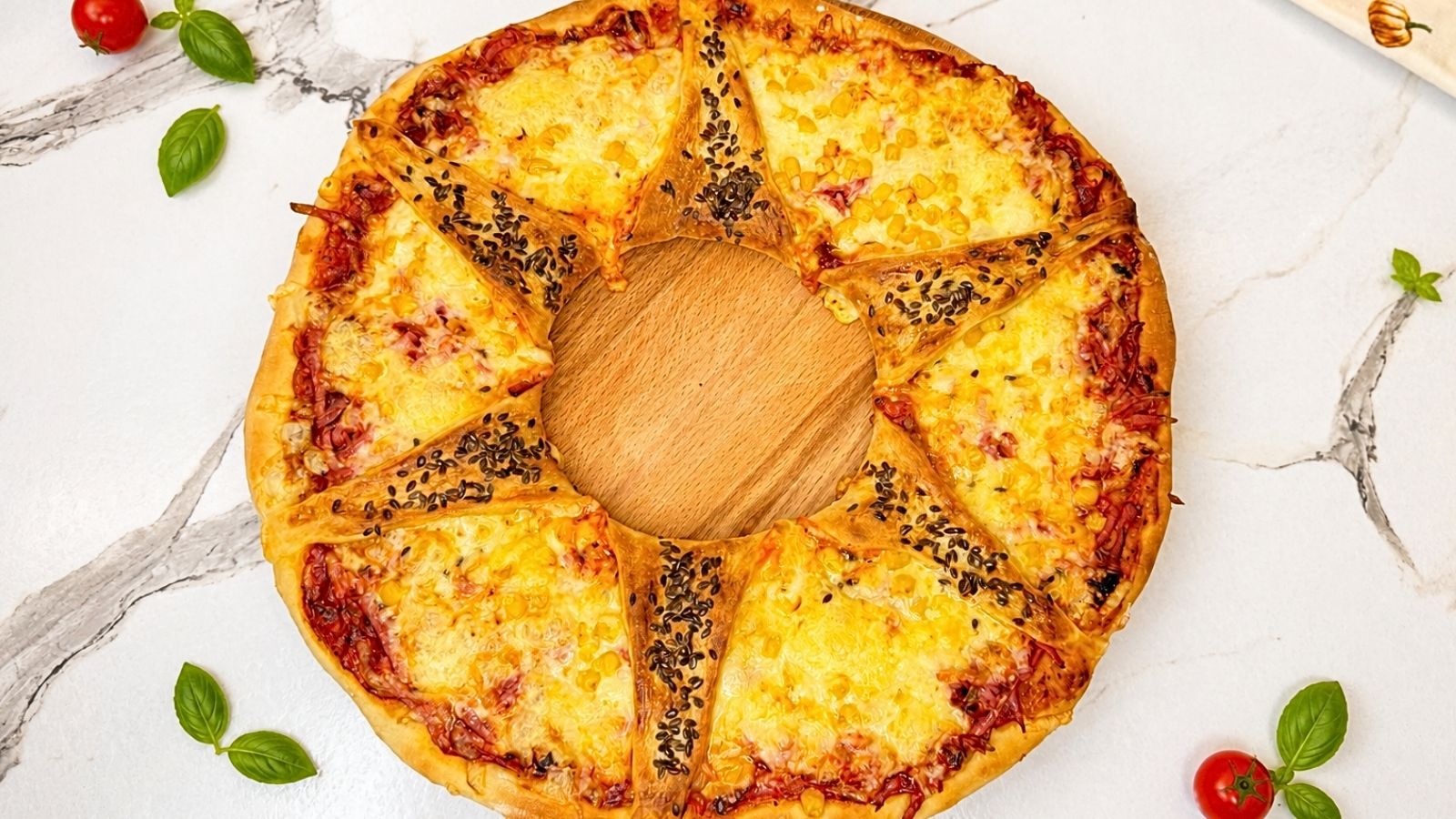 Homemade pizza ring recipe with ham, cheese, corn, and soft pizza dough