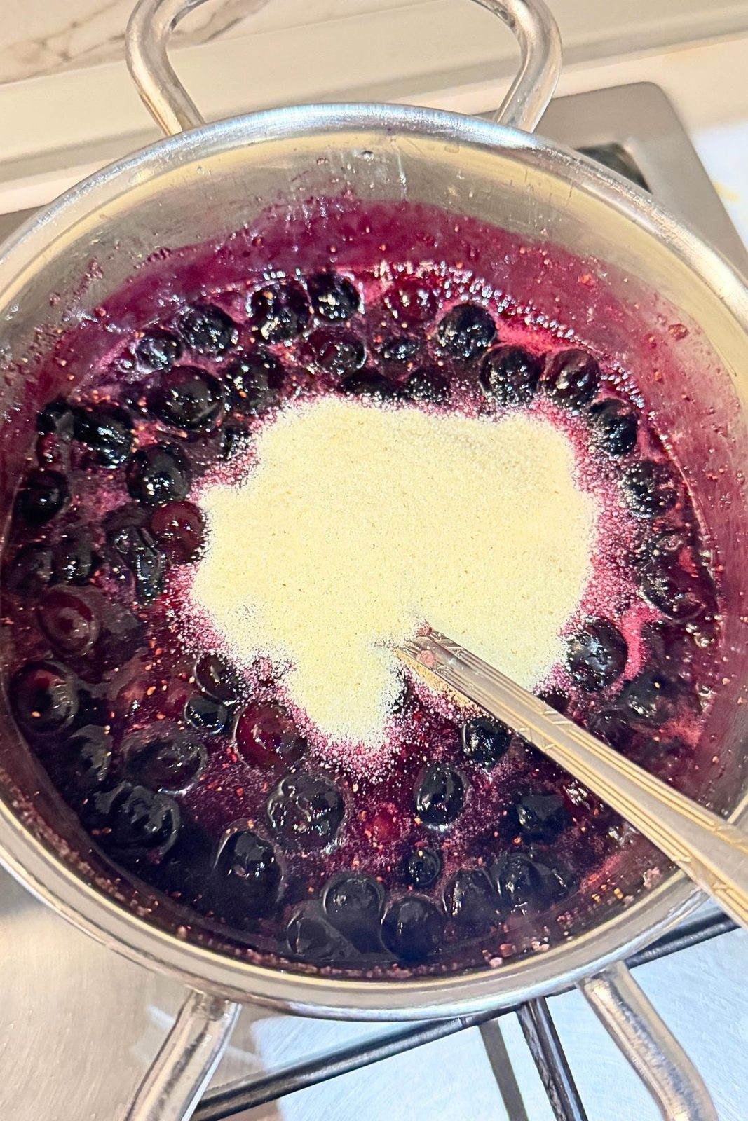 Fine semolina added to simmering blueberries to thicken the turnover filling.