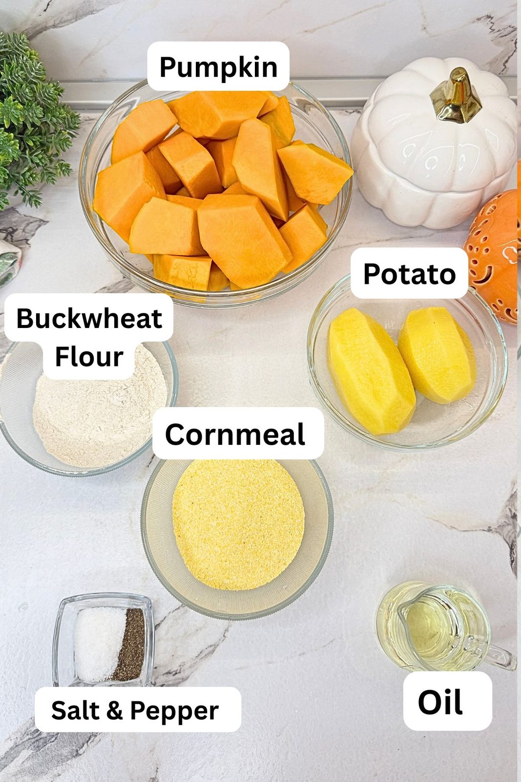 Ingredients for roasted pumpkin and potatoes: pumpkin, potatoes, cornmeal, buckwheat flour, oil, salt, and black pepper.