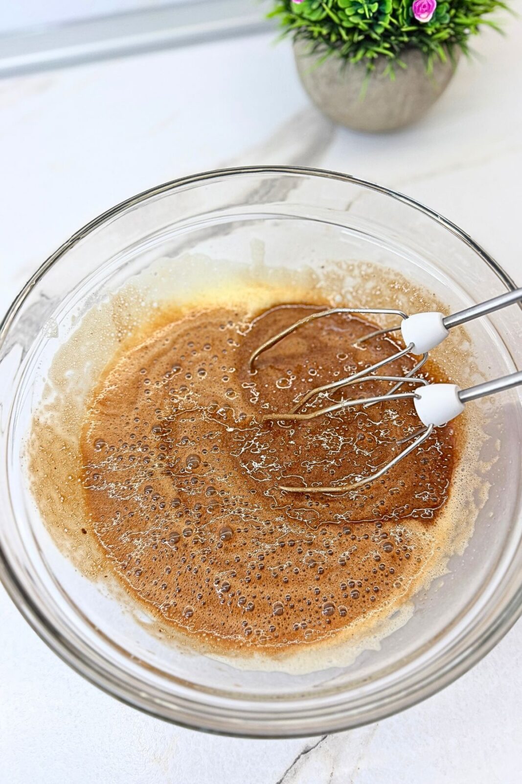 Melted chocolate and butter combined with the beaten egg mixture for chocolate lava cakes.