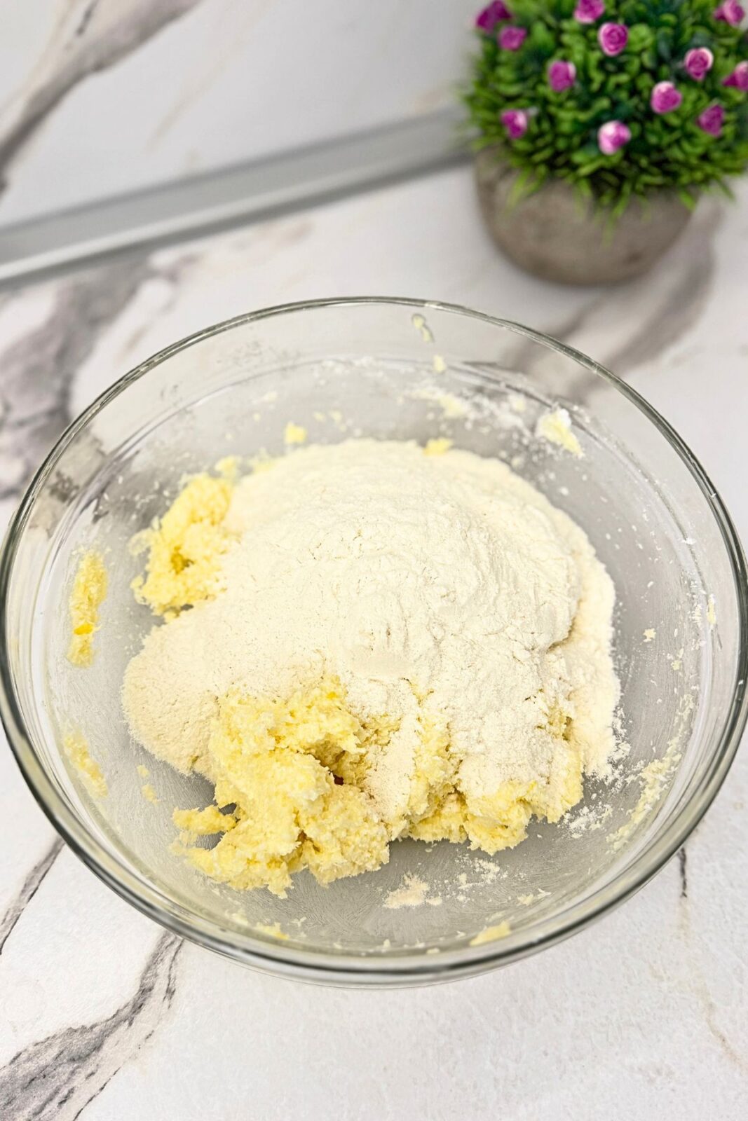 Shredded coconut added to the butter mixture for lemon coconut shortbread cookies.