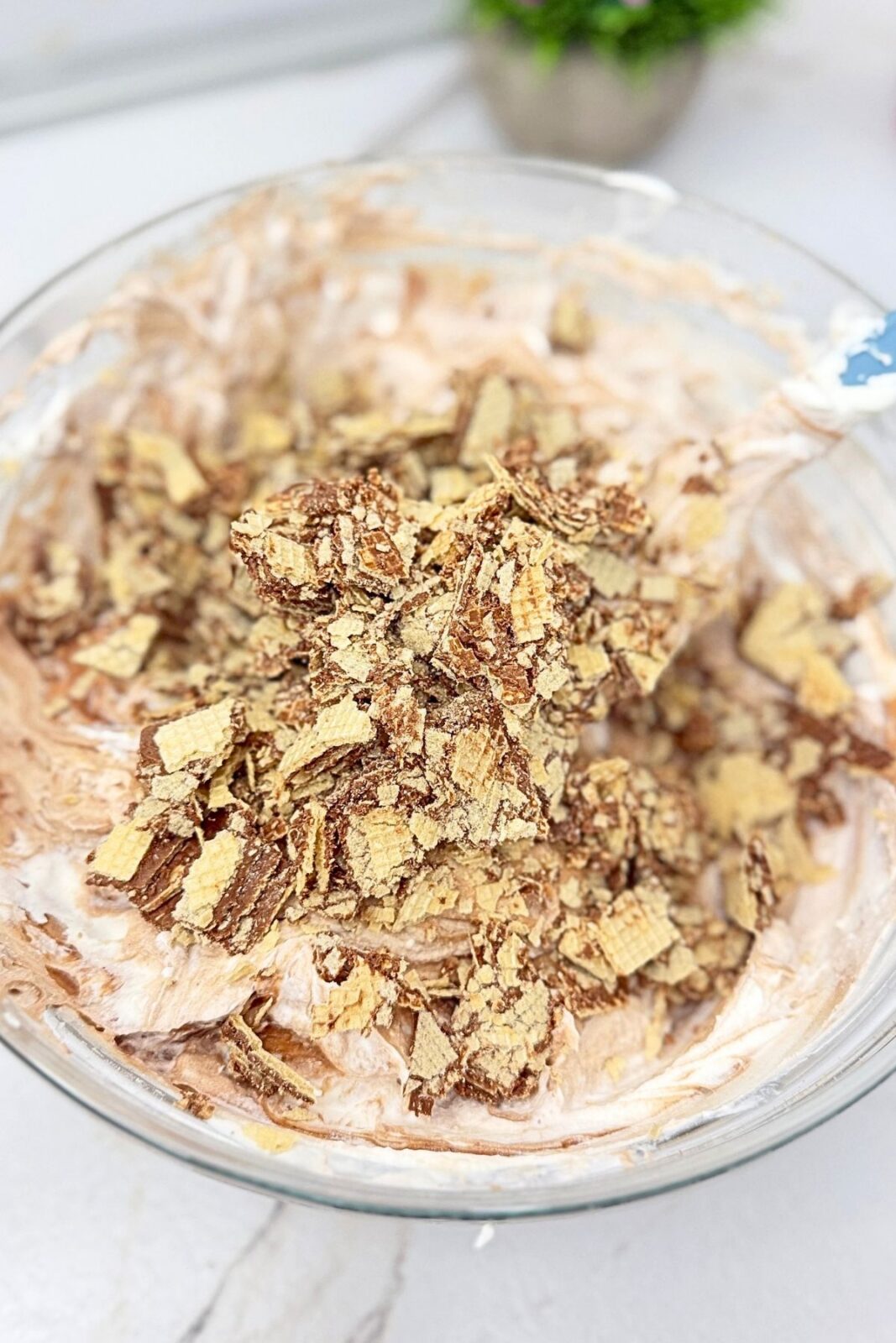 Crumbled hazelnut wafer cookies added to the creamy Nutella cake filling.